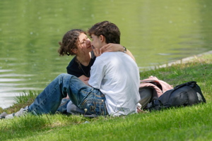 Happy young lovers on the lakeshore